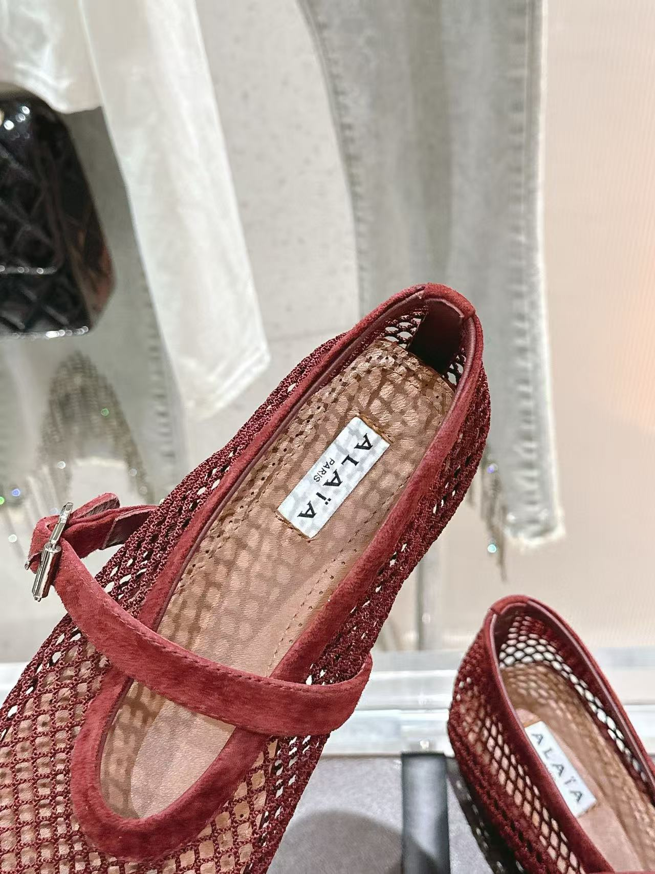 UA ALAÏA BALLET FLATS IN FISHNET